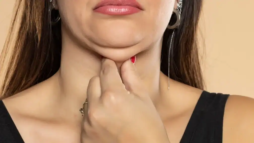 An image of a woman with double chin, sad, worried : Non Surgical Double Chin Removal Treatment in Barry, UK